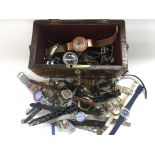 A tea caddy of approx 40 watches.