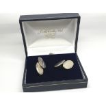 A pair of Gentlemans oval Silver cufflinks.