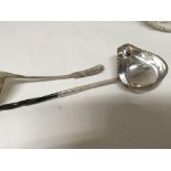 A 19th century white metal toddy ladle with a whal