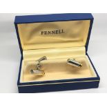 A pair of Fennell silver and gilt cufflinks in the