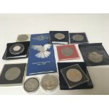 A collection of commemorative crowns coins and som