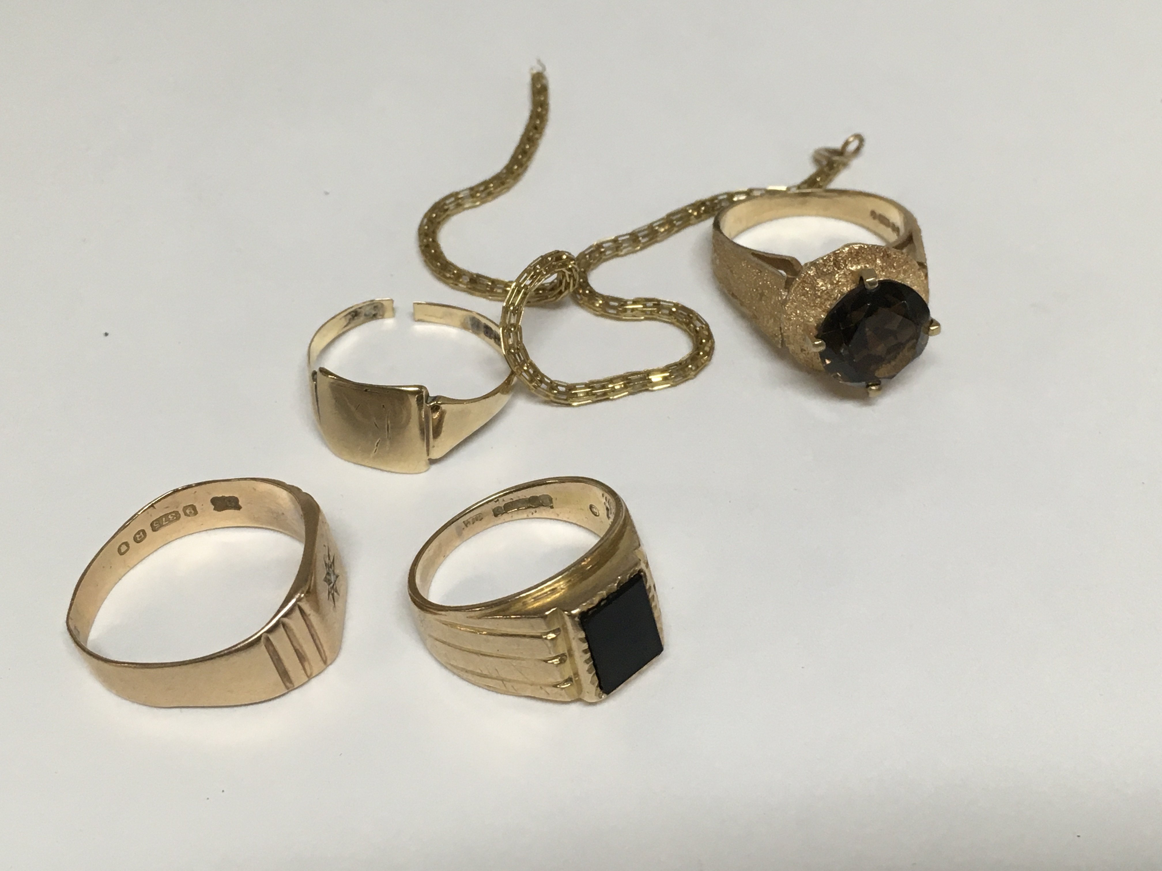 A collection of 9ct gold rings weighing in total a