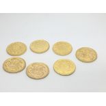 A collection of seven gold coins each 8g in weight