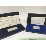 Two silver ingots in fitted cases The Queens Silver Jubilee weight 73g and 95g approximately. (2)