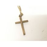 A 9carat gold cross and chain. Weight 4g