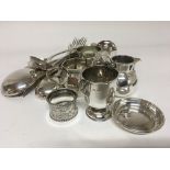 A collection of silver items two jugs a napkin rin