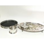 A circular silver plated tray one other oval tray