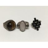 One silver ring set with Tigers eye and two other