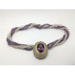 An 18ct gold amethyst and rock crystal necklace.