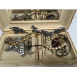 A collection of white metal animal and bird brooch