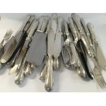 A collection of metal loaded silver cutlery.