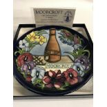 A Collection of eleven Moorcroft year plates from