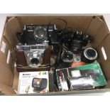 A collection of vintage cameras, lenses and access