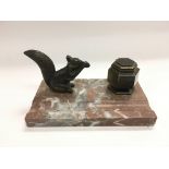 A small Art Deco marble and bronzed desk piece dec