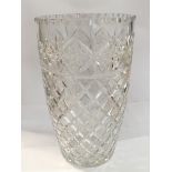 A large cut glass vase and a silver plated hors-d'