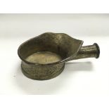 An old brass ladle, possibly Oriental, missing han