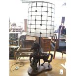 A large carved hardwood lamp in the form of a hors
