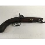 A 19 th century flintlock pistol with carved walnu