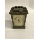 A brass case carriage clock the dial with Arabic n