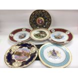 A collection of cabinet plates including a hand pa