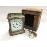 A brass cased carriage clock with original outer t