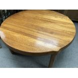 A large circular Danish occasional table and two o