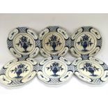 Six blue and white Delft plates decorated with flo