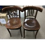 A pair of Bon wood chairs.