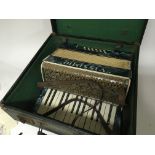 A Vintage cased Vissimo accordion.