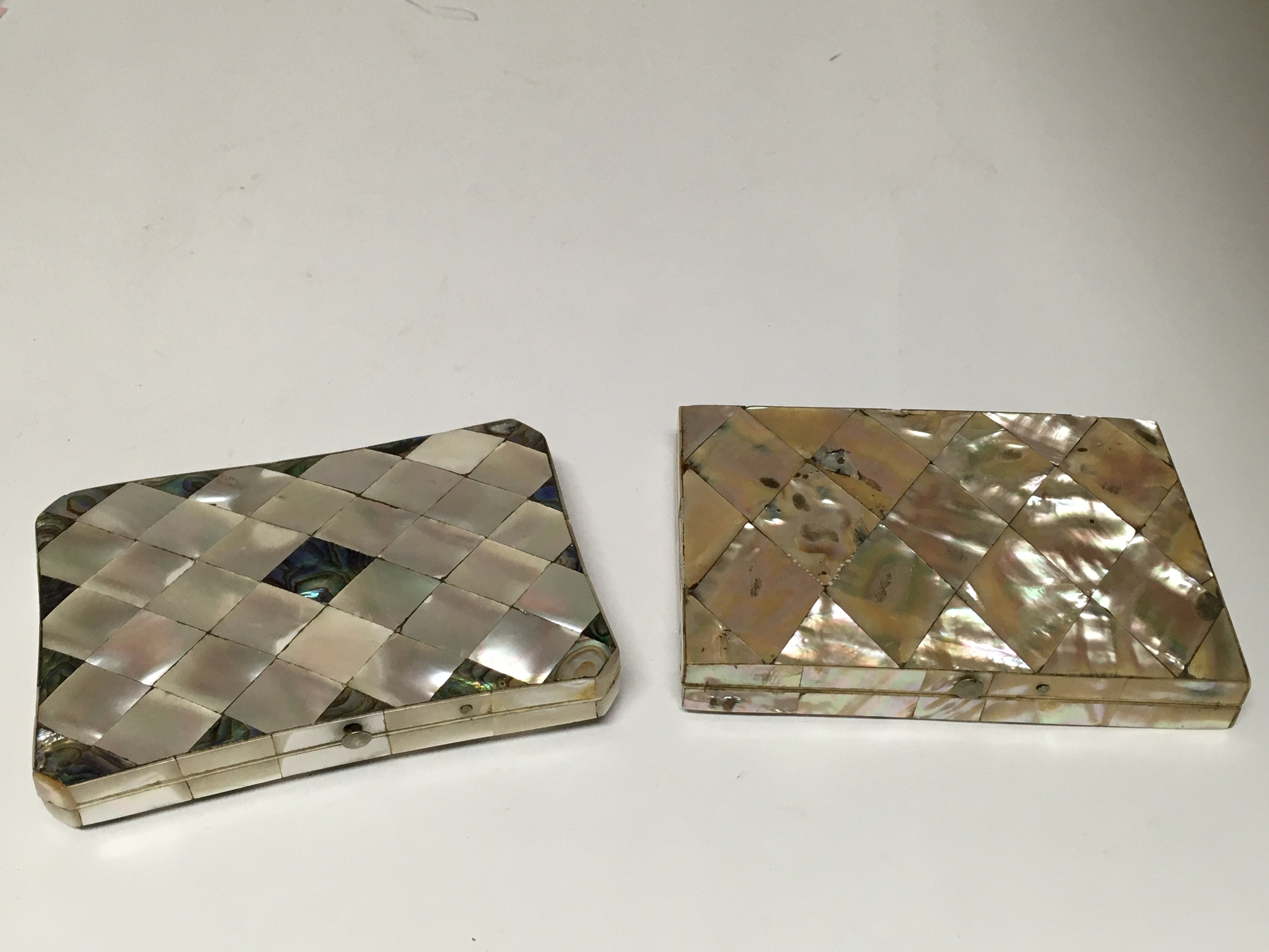 Two mother of pearl purses.