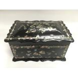 A Victorian papier mache tea caddy with mother of