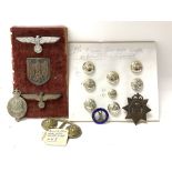 Military badges and buttons.
