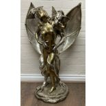 A large two tone polished bronze sculpture entitled Erotic Dragon of a double headed dragon and a nu