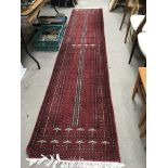 A hand knotted Turkish runner with a repeat patter
