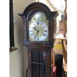 An oak long case clock with a gilt dial silvered c