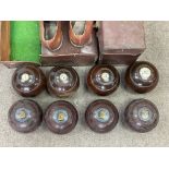 A set of 4 official 1949 stamped Lignum Vitai boules with Ivory inlaid panels. Together with a later