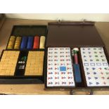 Two modern Mahjong sets and gaming tokens.