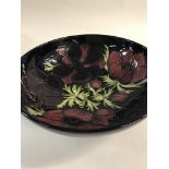 A Moorcroft bowl decorated with poppies .26 cm wit