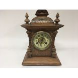 A Continental walnut mantel clock with metal mount