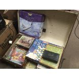 A trunk containing vintage games and puzzles (a lo