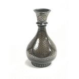 A small Indian Bidriware vase inlaid with silver,