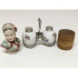 A set of salt and pepper shakers with silver holde
