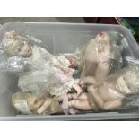 A box of dolls, doll parts, child's Singer sewing