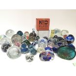 A collection of glass paperweights including Caith
