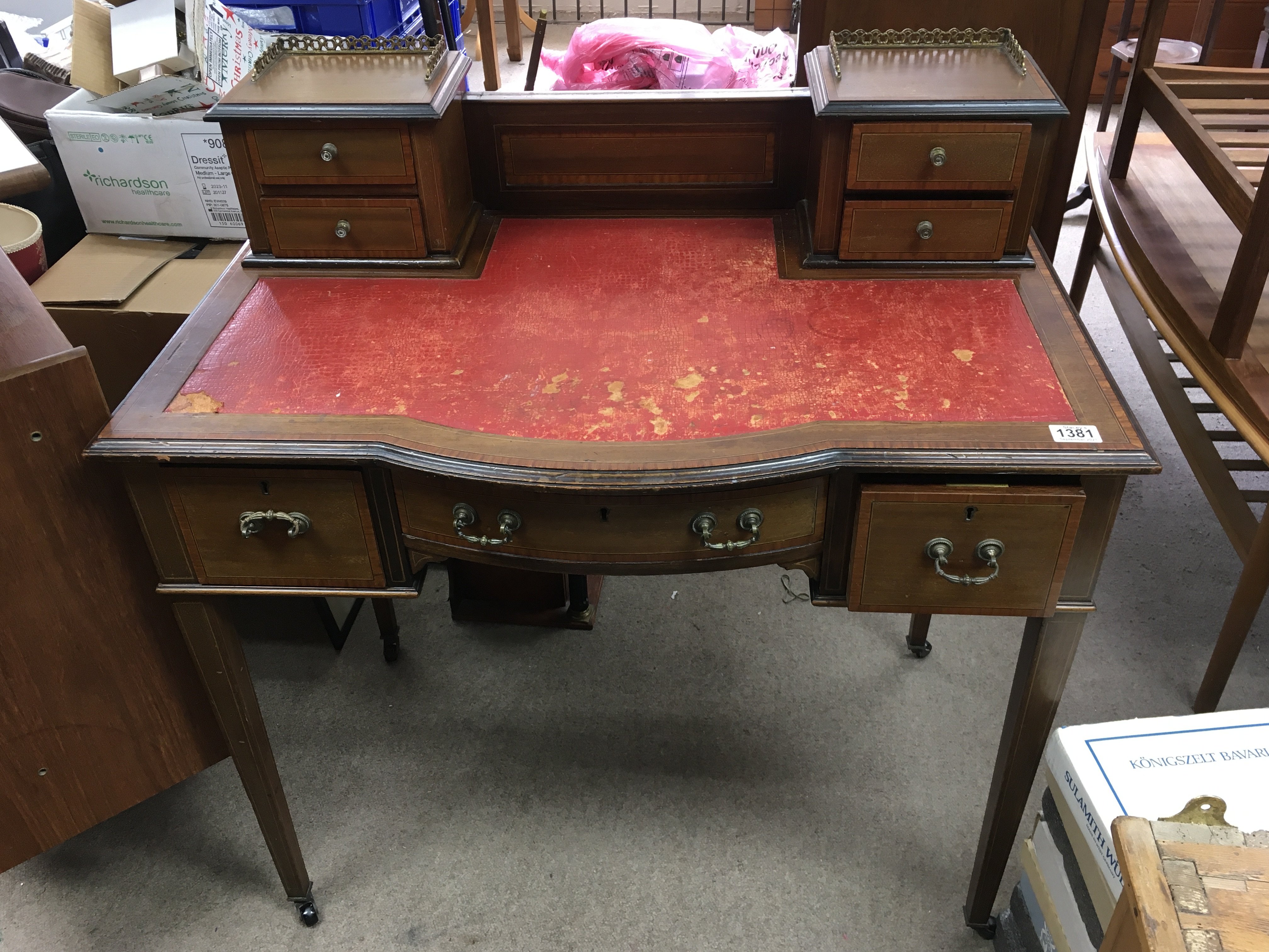 An Edwardian inlaid mahogany desk. Measuring appro