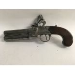 A double barrel flintlock pistol with engraved pla