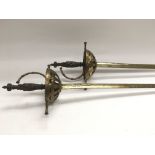 A pair of rapier swords with brass and metal hilts