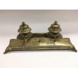 A 19th Century brass desk piece, missing liners to