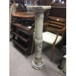 An alabaster pedestal, measuring approximately in