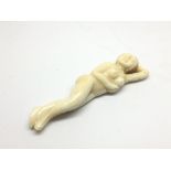 A small ivory nude figure of a recloning lady, app